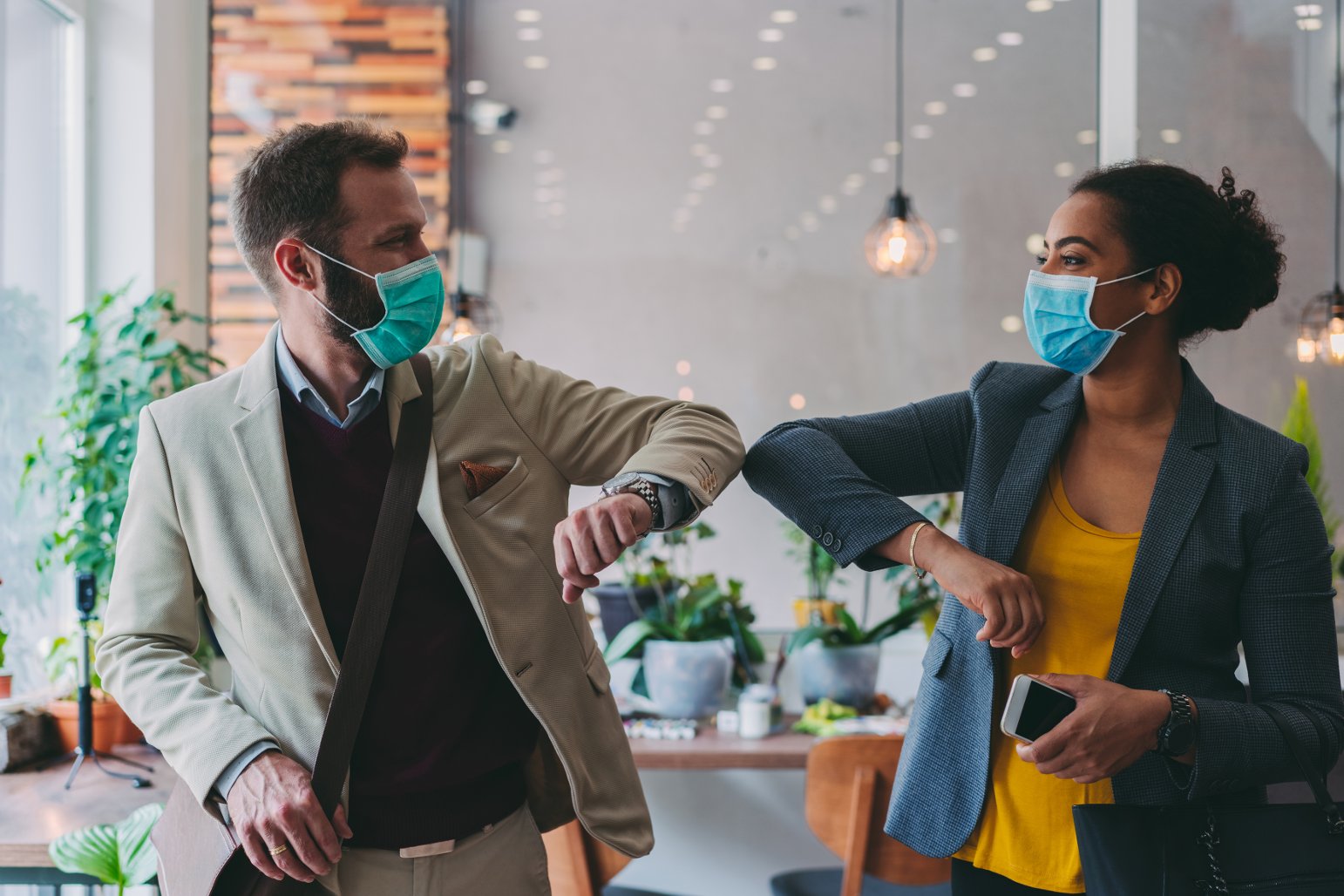 Image of two people wearing masks