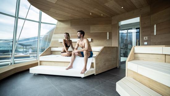 Image of a couple in an outdoor pool on the rooftop 